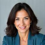 Profile of Dr. Elena Reyes, Co-Founder and Lead Strategist, looking professional and approachable.