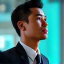 Headshot of a visionary Filipino tech CEO, Jose Reyes, with a blurred high-tech office background and subtle glow effects.