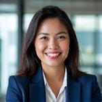 Portrait of Dr. Elena Rivera, CEO of a leading tech startup in Manila, smiling confidently.