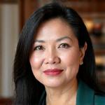 Portrait of Atty. Sofia Reyes, a prominent legal counsel for SMEs, with a thoughtful expression.